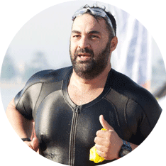 IRONMAN age grouper in wetsuit at race